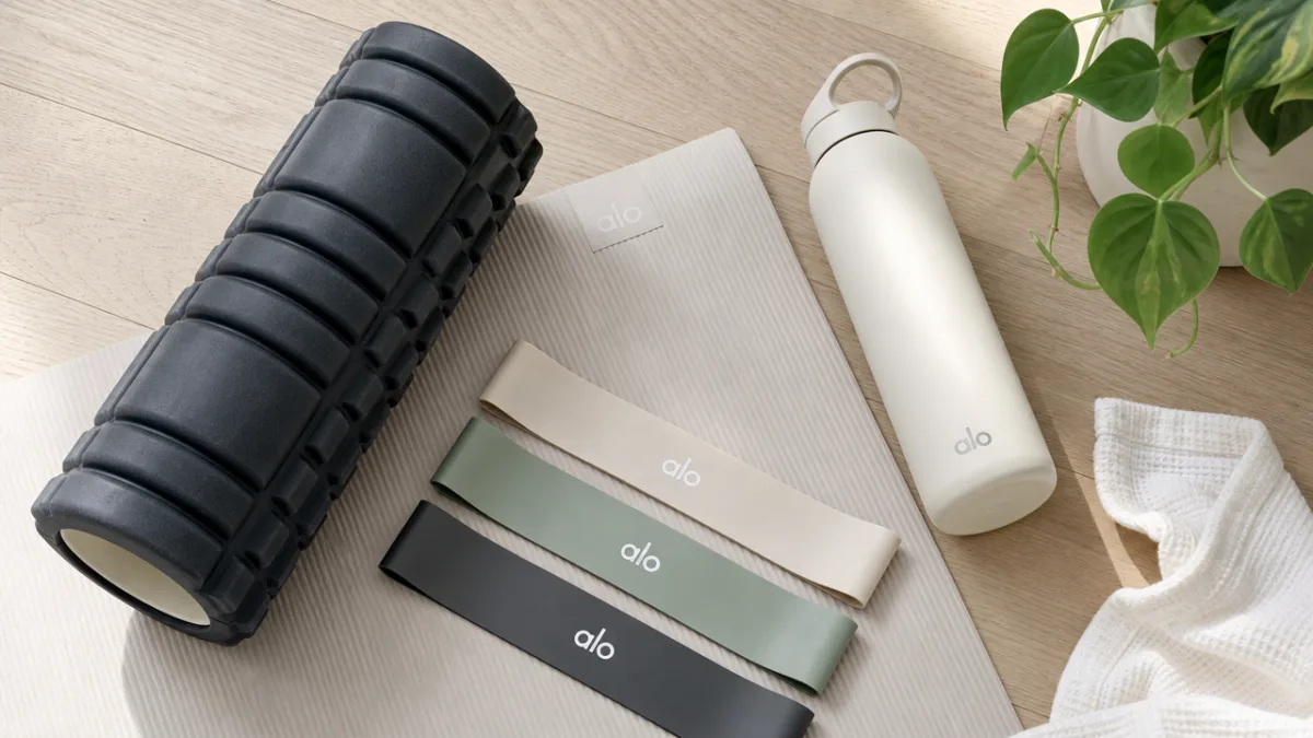a clean modern wellness flat lay with foam roller resistance bands and…