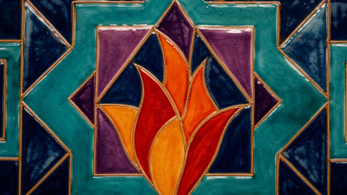 close-up of hand-painted geometric tile fire art in jewel tones with wet…